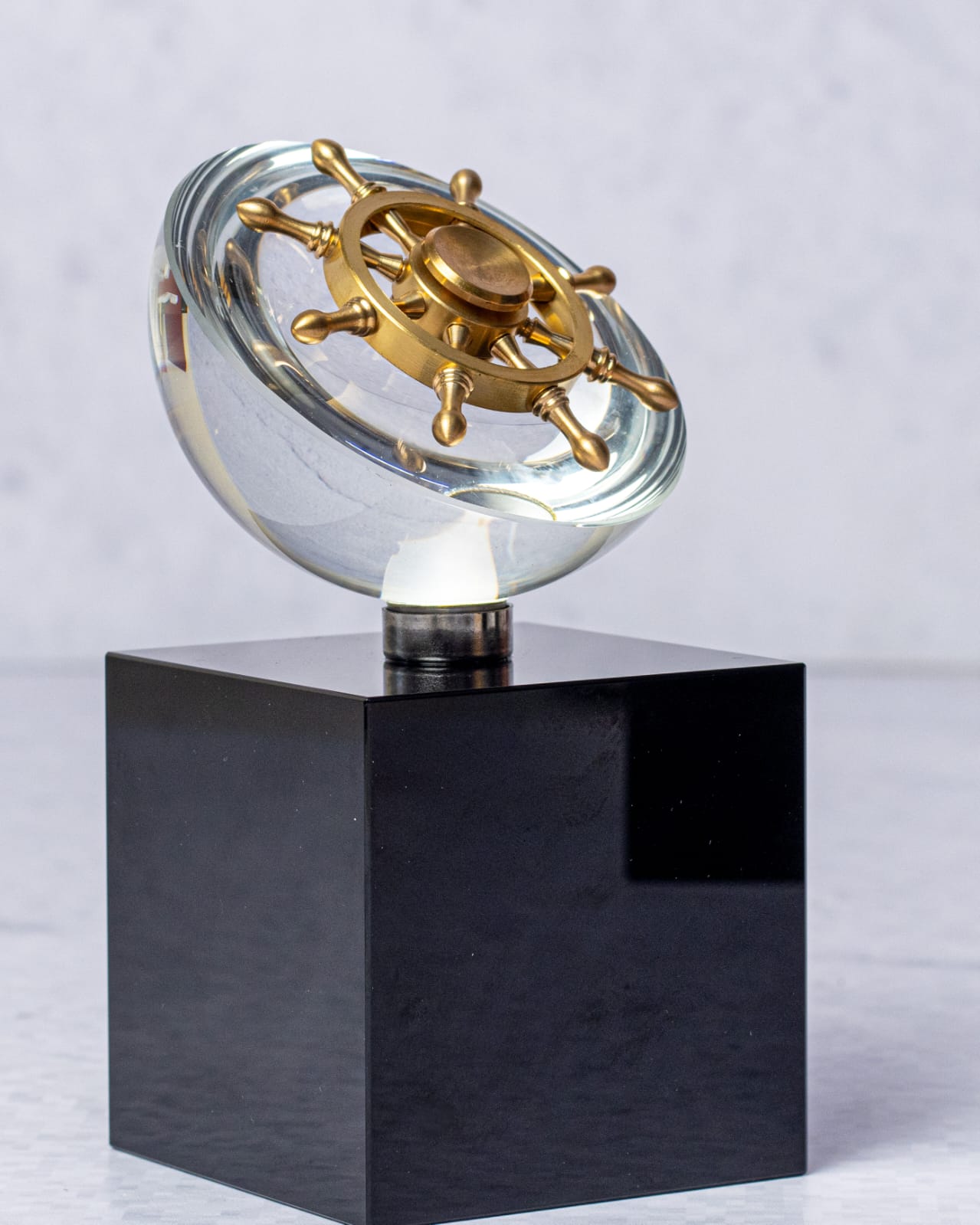 Rotating ship's wheel crystal award