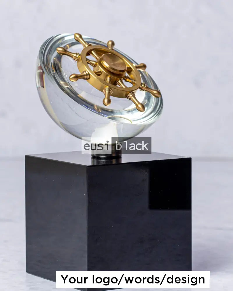 Rotating ship’s wheel crystal award