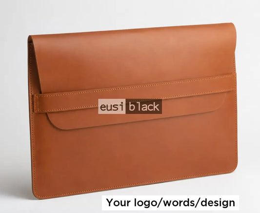 Strapped leather laptop sleeve